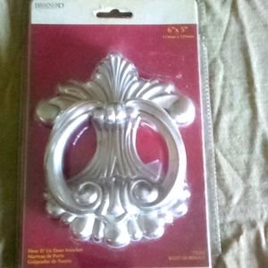 Brained vintage new in package doorknocker